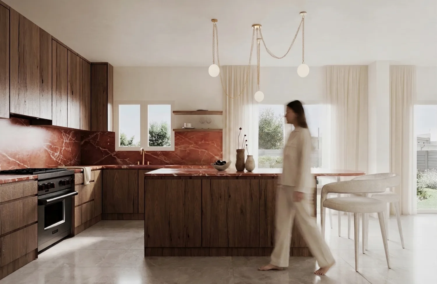 Walnut kitchen with a red stone backsplash and a person walking past the island